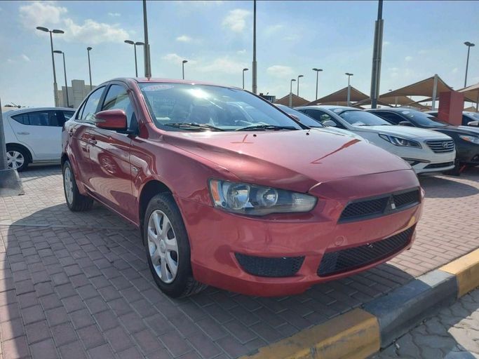 Подержанный Mitsubishi Lancer X Рестайлинг 2, 2.4 л, 2016 в Шардже от Alhamoor Used Cars Красный цвет. GCC | AUTO.AE