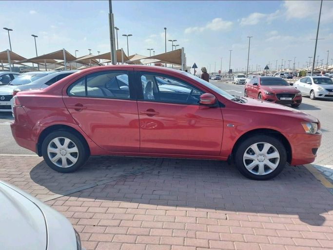 Подержанный Mitsubishi Lancer X Рестайлинг 2, 2.4 л, 2016 в Шардже от Alhamoor Used Cars Красный цвет. GCC | AUTO.AE