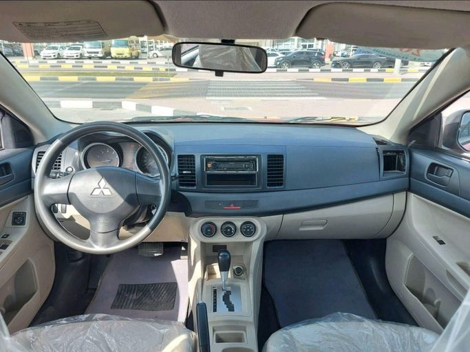 Подержанный Mitsubishi Lancer X Рестайлинг 2, 2.4 л, 2016 в Шардже от Alhamoor Used Cars Красный цвет. GCC | AUTO.AE