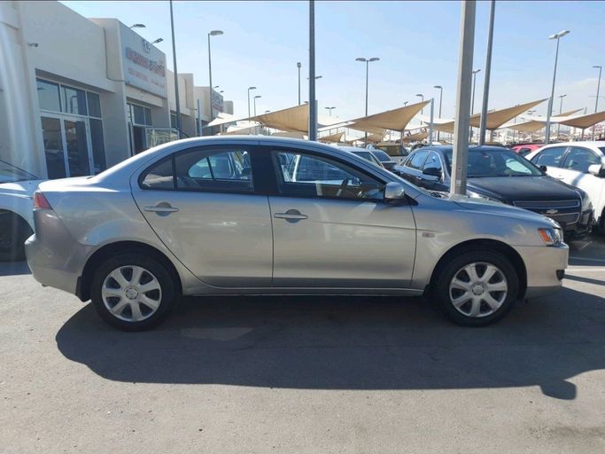 Used Mitsubishi Lancer X Facelift, 1.6 l, 2013 in Sharjah by Al Qanaah Used Cars, Silver color. GCC Specs | AUTO.AE