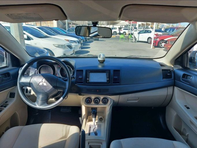 Used Mitsubishi Lancer X Facelift, 1.6 l, 2013 in Sharjah by Al Qanaah Used Cars, Silver color. GCC Specs | AUTO.AE