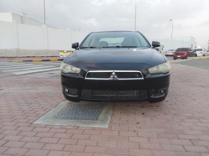 Подержанный Mitsubishi Lancer X Рестайлинг 2, 2.0 л, 2016 в Шардже от Laqtah Used Cars Черный цвет. GCC | AUTO.AE