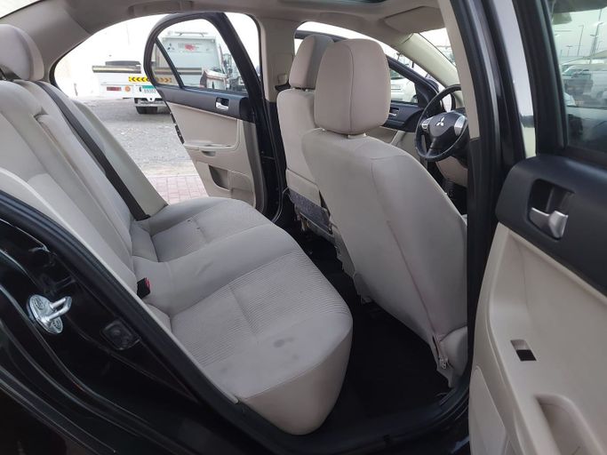 Подержанный Mitsubishi Lancer X Рестайлинг 2, 2.0 л, 2016 в Шардже от Laqtah Used Cars Черный цвет. GCC | AUTO.AE