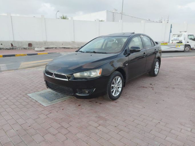 Подержанный Mitsubishi Lancer X Рестайлинг 2, 2.0 л, 2016 в Шардже от Laqtah Used Cars Черный цвет. GCC | AUTO.AE