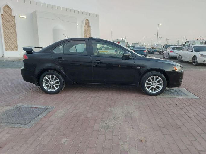 Подержанный Mitsubishi Lancer X Рестайлинг 2, 2.0 л, 2016 в Шардже от Laqtah Used Cars Черный цвет. GCC | AUTO.AE