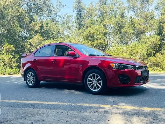 Подержанный Mitsubishi Lancer X Рестайлинг 2, 2.0 л, 2017 в Шардже от Bashar Karoomi Kunani Красный цвет. GCC | AUTO.AE