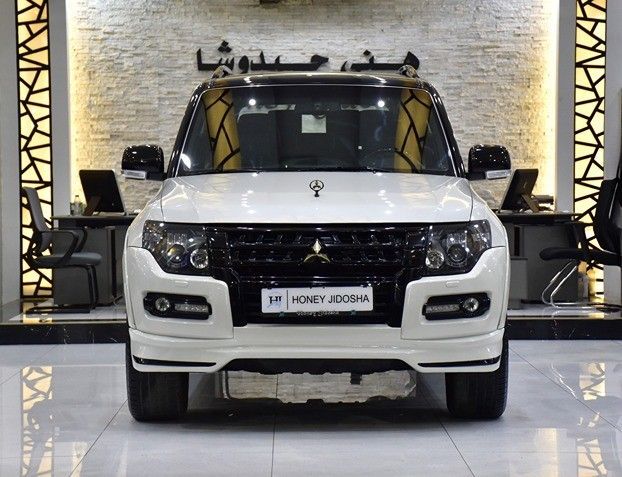 Подержанный Mitsubishi Pajero IV Рестайлинг 2, 3.8 л, 2020 в Шардже от Honey Gidosha Used Cars Tr. Белый цвет.  | AUTO.AE