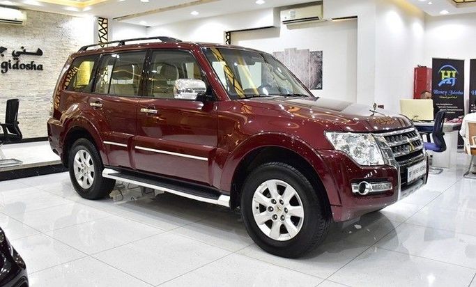 Подержанный Mitsubishi Pajero IV Рестайлинг 2, 3.0 л, 2022 в Шардже от Honey Gidosha Used Cars Tr. Бордовый цвет.  | AUTO.AE
