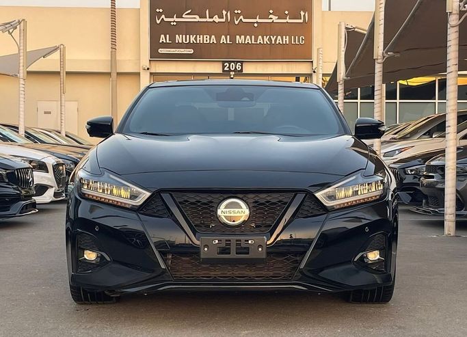 Подержанный Nissan Maxima VIII (A36) Рестайлинг, 3.5 л, 2021 в Шардже от Al Nukhba Al Malakyah Used Cars Черный цвет. Американская | AUTO.AE