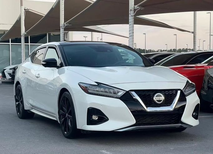 Подержанный Nissan Maxima VIII (A36) Рестайлинг, 3.5 л, 2019 в Шардже от Al Nukhba Al Malakyah Used Cars Белый цвет. Американская | AUTO.AE