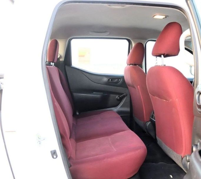 Подержанный Nissan Navara (Frontier) IV (D23), 2.5 л, 2022 в Шардже от Al Sayed Khamis Used Cars Белый цвет. GCC | AUTO.AE