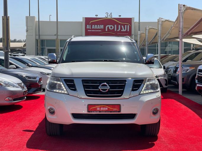Подержанный Nissan Patrol VI (Y62) Рестайлинг, 5.6 л, 2014 в Шардже от Al Aram Cars Белый цвет. GCC | AUTO.AE