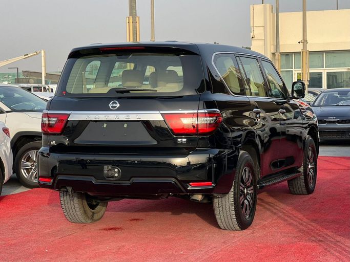 Подержанный Nissan Patrol VI (Y62) Рестайлинг 2, 4.0 л, 2021 в Шардже от Al Aram Cars Черный цвет. GCC | AUTO.AE