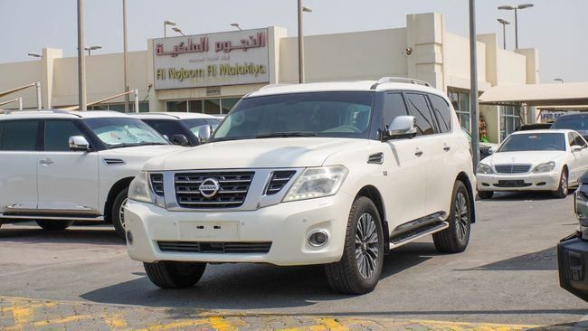 Подержанный Nissan Patrol VI (Y62), 5.6 л, 2014 в Шардже от Alnujoom Al Malakiah Used Cars Белый цвет. GCC | AUTO.AE