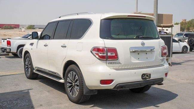 Подержанный Nissan Patrol VI (Y62), 5.6 л, 2014 в Шардже от Alnujoom Al Malakiah Used Cars Белый цвет. GCC | AUTO.AE