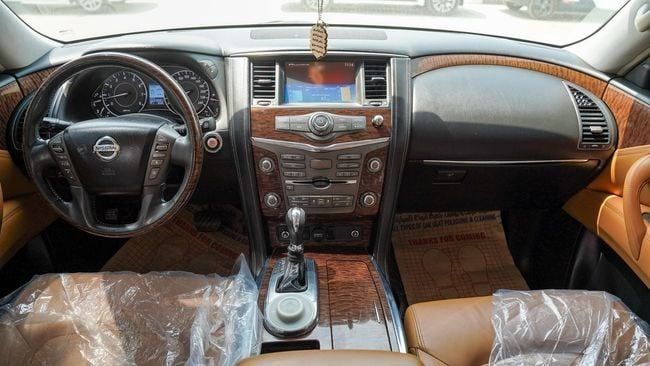 Used Nissan Patrol VI (Y62), 5.6 l, 2014 in Sharjah by Alnujoom Al Malakiah Used Cars, White color. GCC Specs | AUTO.AE