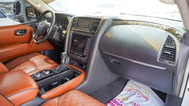 Used Nissan Patrol VI (Y62) Facelift 2, 5.6 l, 2020 in Sharjah by Alnujoom Al Malakiah Used Cars, White color. GCC Specs | AUTO.AE