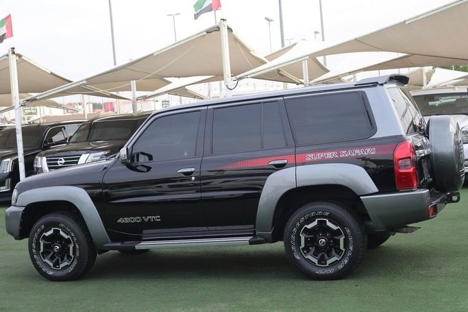 Подержанный Nissan Patrol V (Y61) Рестайлинг, 4.8 л, 2021 в Шардже от Al Bake Used Cars Черный цвет. GCC | AUTO.AE