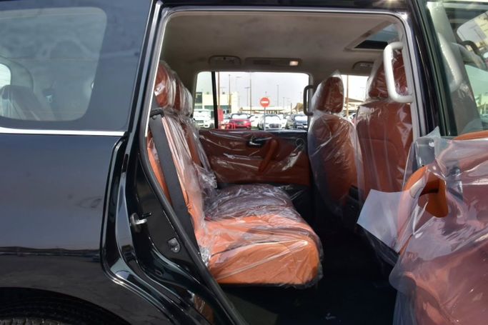 Новый Nissan Patrol VI (Y62) Рестайлинг 2, 5.6 л, 2024 в Шардже от Alfaris Used Cars Черный цвет. GCC | AUTO.AE