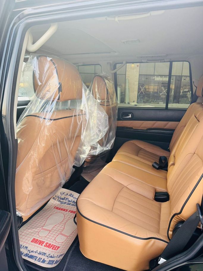 Used Nissan Patrol V (Y61) Facelift, 4.8 l, 2021 in Sharjah by Al Ostoura Used Cars, Black color. Other | AUTO.AE