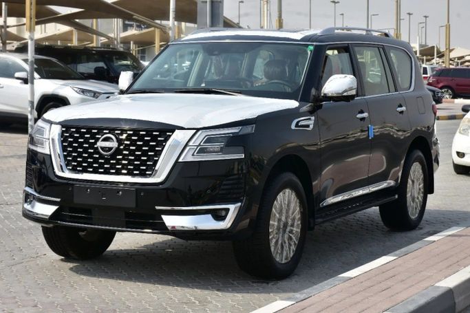 Подержанный Nissan Patrol VI (Y62) Рестайлинг 2, 4.0 л, 2024 в Шардже от Alfaris Used Cars Черный цвет. GCC | AUTO.AE