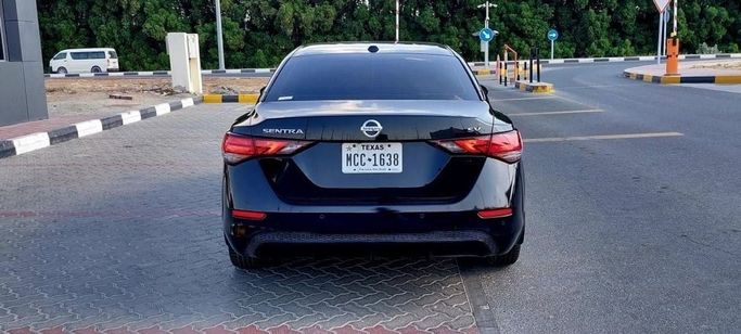 Used Nissan Sentra VIII (B18), 2.0 l, 2021 in Sharjah by Tabarak Used Cars, Black color. American Specs | AUTO.AE