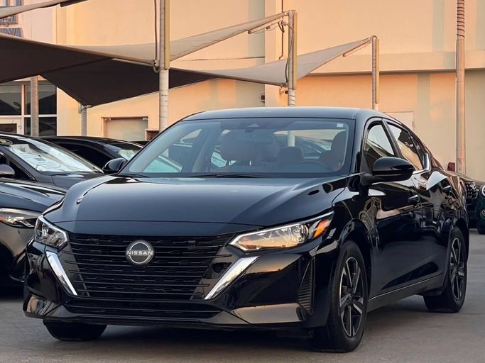 Подержанный Nissan Sentra VIII (B18) Рестайлинг, 2.0 л, 2024 в Шардже от Al Nukhba Al Malakyah Used Cars Черный цвет. Американская | AUTO.AE