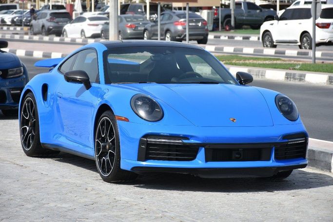 Подержанный Porsche 911 Turbo VIII (992), 3.7 л, 2023 в Шардже от Alfaris Used Cars Синий цвет.  | AUTO.AE