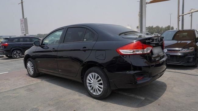 Подержанный Suzuki Ciaz I Рестайлинг, 1.5 л, 2023 в Шардже от Alnujoom Al Malakiah Used Cars Черный цвет. GCC | AUTO.AE