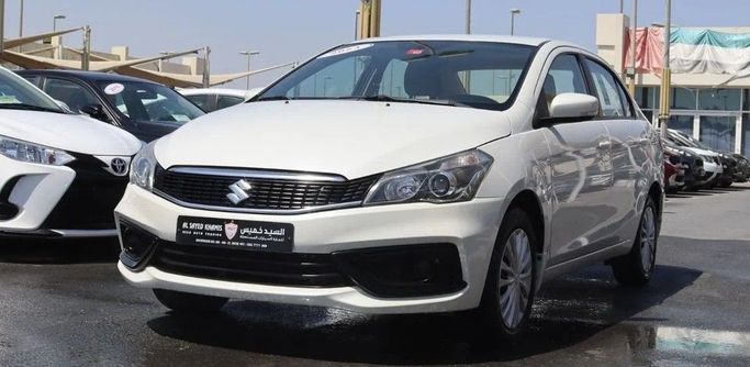 Подержанный Suzuki Ciaz I Рестайлинг, 1.5 л, 2023 в Шардже от Al Sayed Khamis Used Cars Белый цвет. GCC | AUTO.AE