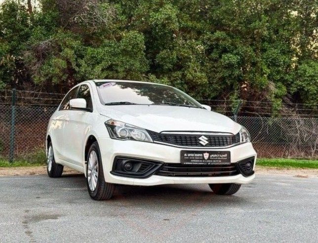 Подержанный Suzuki Ciaz I Рестайлинг, 1.5 л, 2023 в ОАЭ, Шарджа от Al Sayed Khamis Used Cars Белый цвет. GCC | AUTO.AE | Объявление #275201