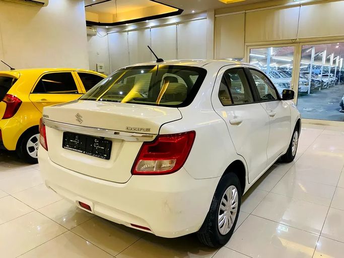 Used Suzuki DZire III Facelift, 1.2 l, 2025 in UAE, Sharjah by AlHamoor, White color. GCC Specs | AUTO.AE | Listing #295146 — photo 10 of 14