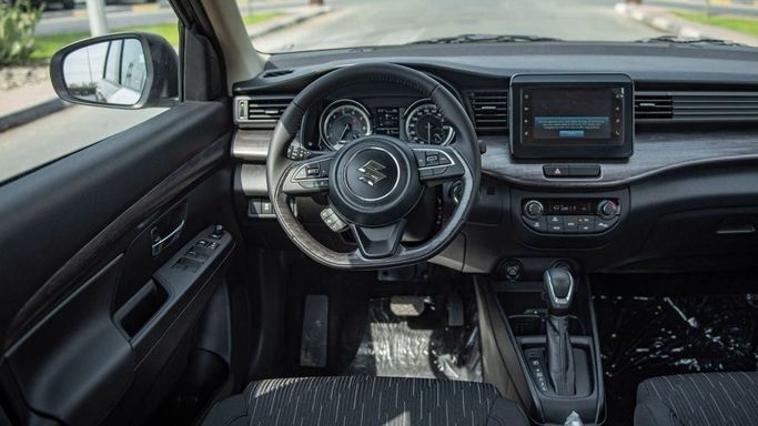 Новый Suzuki Ertiga II Рестайлинг, 1.5 л, 2023 в Шардже от Nour Alnukhba Motors Коричневый цвет. Other | AUTO.AE