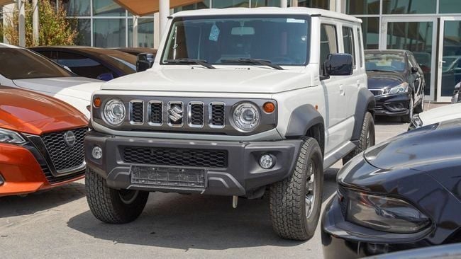 Used Suzuki Jimny IV, 1.5 l, 2024 in Sharjah by Alnujoom Al Malakiah Used Cars, White color. GCC Specs | AUTO.AE