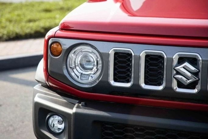 New Suzuki Jimny IV, 1.5 l, 2025 in Sharjah by Nour Alnukhba Motors, Red color. Other | AUTO.AE