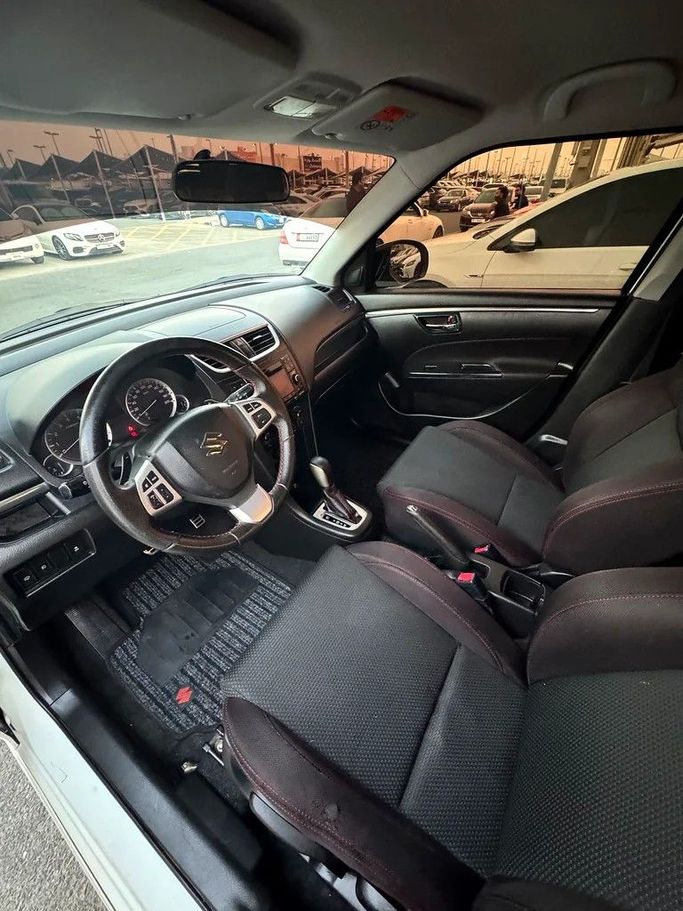 Подержанный Suzuki Swift V, 1.4 л, 2016 в Шардже от Taj Al Impratoor Used Cars Белый цвет. GCC | AUTO.AE