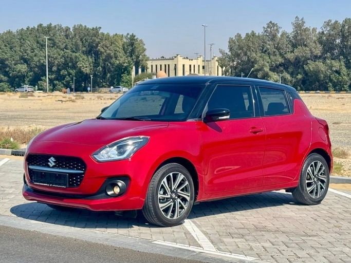 Used Suzuki Swift V, 1.2 l, 2024 in Sharjah by Noor Al Seyoh Used Cars, Red color. GCC Specs | AUTO.AE