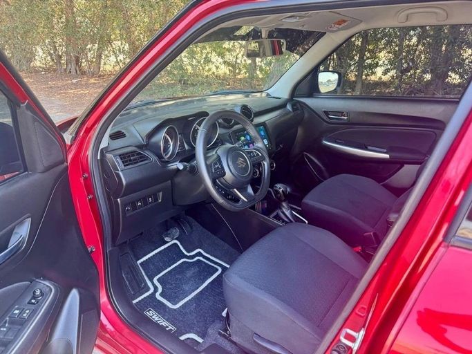Used Suzuki Swift V, 1.2 l, 2024 in Sharjah by Noor Al Seyoh Used Cars, Red color. GCC Specs | AUTO.AE
