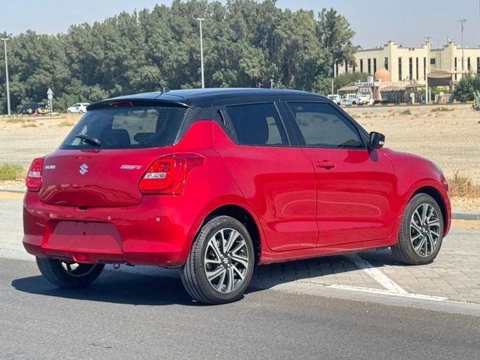 Used Suzuki Swift V, 1.2 l, 2024 in Sharjah by Noor Al Seyoh Used Cars, Red color. GCC Specs | AUTO.AE