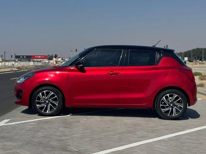 Used Suzuki Swift V, 1.2 l, 2024 in Sharjah by Noor Al Seyoh Used Cars, Red color. GCC Specs | AUTO.AE