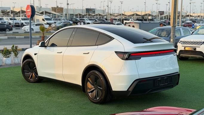 New Tesla Model Y I Facelift, 2025 in Sharjah by Badar Used Cars, White color.  | AUTO.AE