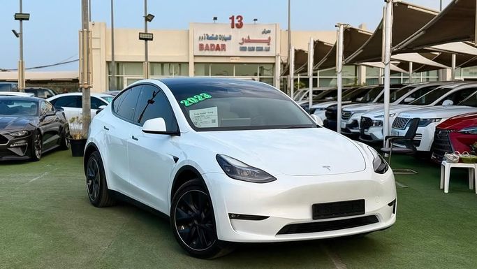New Tesla Model Y Performance I, 2023 in Sharjah by Badar Used Cars, White color.  | AUTO.AE