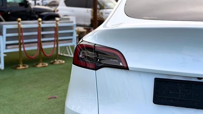 New Tesla Model Y Performance I, 2023 in Sharjah by Badar Used Cars, White color.  | AUTO.AE
