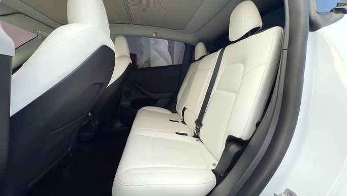 New Tesla Model Y Performance I, 2023 in Sharjah by Badar Used Cars, White color.  | AUTO.AE