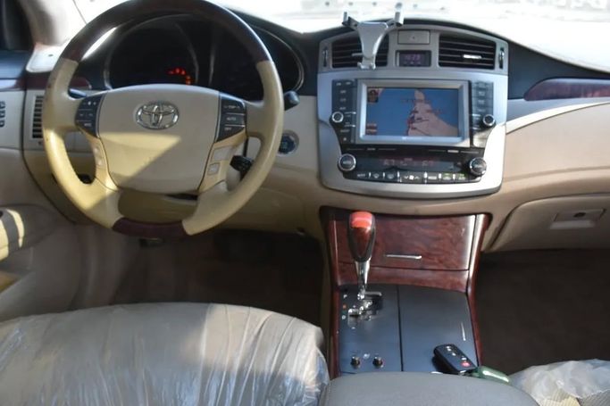 Подержанный Toyota Avalon III Рестайлинг 2, 3.5 л, 2011 в Шардже от Alfaris Used Cars Золотистый цвет. Other | AUTO.AE