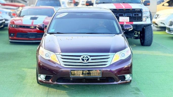 Подержанный Toyota Avalon III Рестайлинг 2, 3.5 л, 2011 в Шардже от Hesham Safwat  Used Cars Бордовый цвет. GCC | AUTO.AE