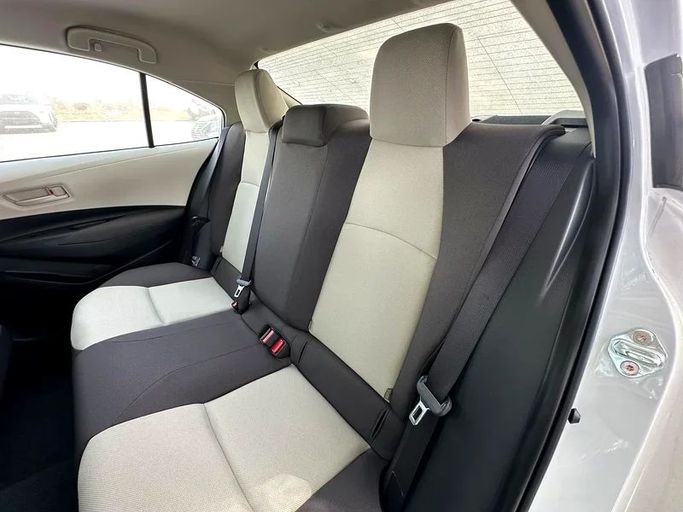 New Toyota Corolla XII (E210), 1.6 l, 2025 in Sharjah by Almarid Motors, White color. GCC Specs | AUTO.AE