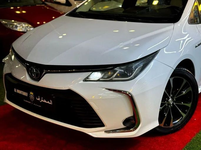 Used Toyota Corolla Sporty XII (E210), 1.8 l, 2020 in Sharjah by Al Muhtaref Used Cars, White color. GCC Specs | AUTO.AE