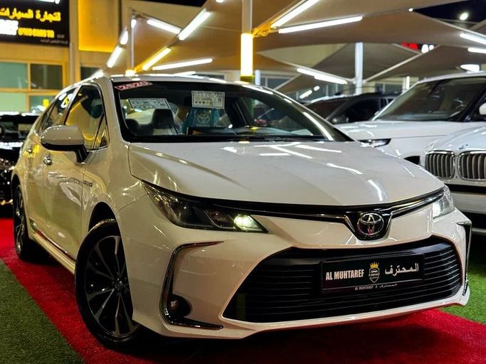 Used Toyota Corolla Sporty XII (E210), 1.8 l, 2020 in Sharjah by Al Muhtaref Used Cars, White color. GCC Specs | AUTO.AE