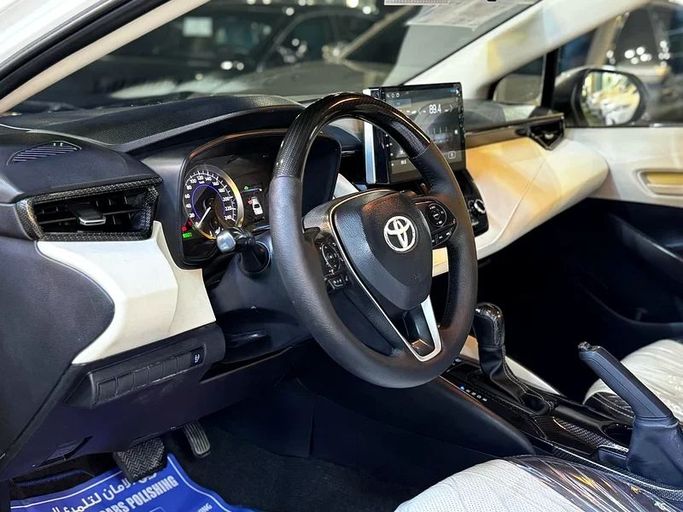 Used Toyota Corolla Sporty XII (E210), 1.8 l, 2020 in Sharjah by Al Muhtaref Used Cars, White color. GCC Specs | AUTO.AE